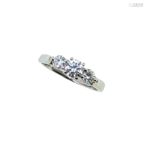 A platinum three stone diamond ring,