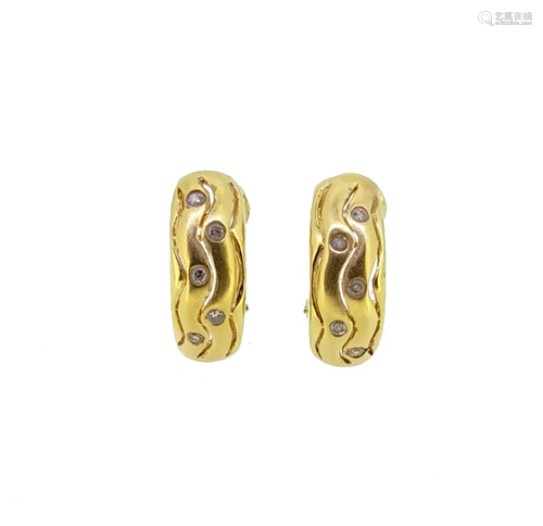 A pair of diamond set ear clips,