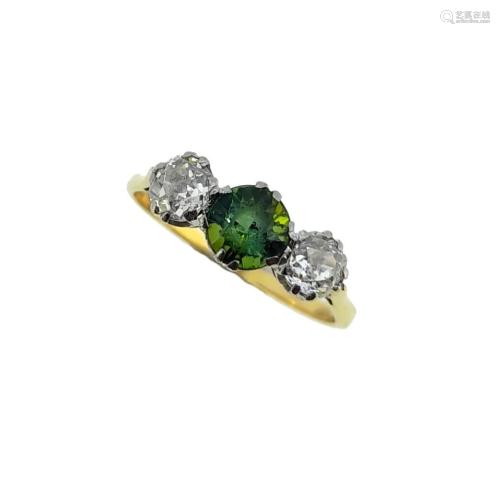 A tourmaline and diamond three stone ring,