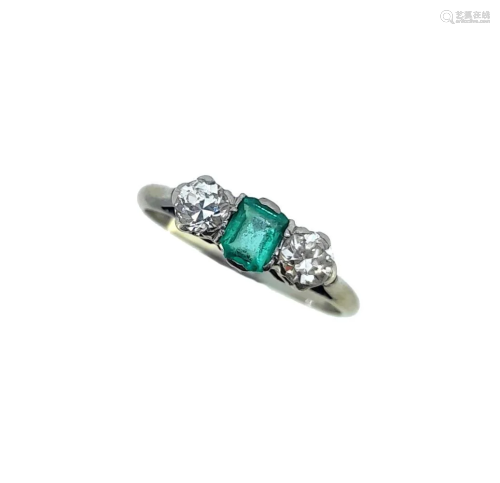 A mid 20th century emerald and diamond three stone ring,