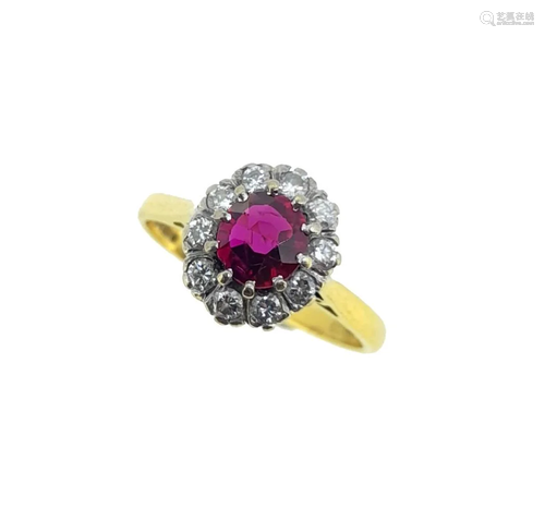 An 18ct gold ruby and diamond cluster ring,