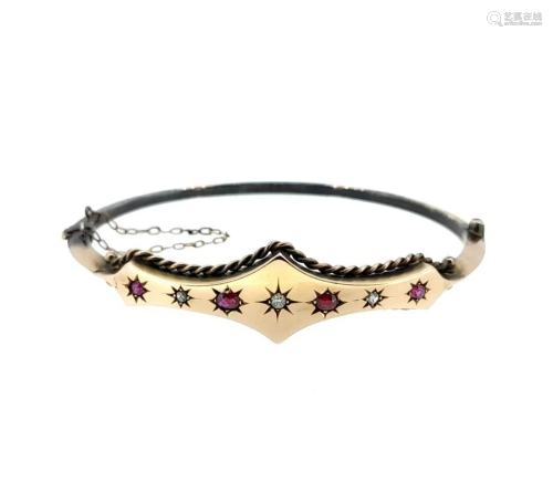 A Victorian 9ct gold ruby and diamond bangle,