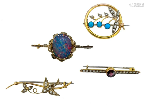 A collection of four brooches,