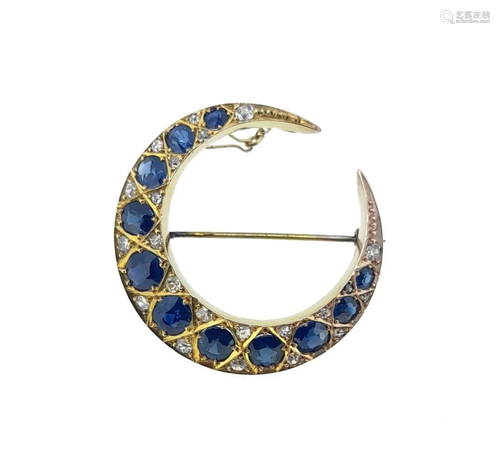 A sapphire and diamond crescent brooch,