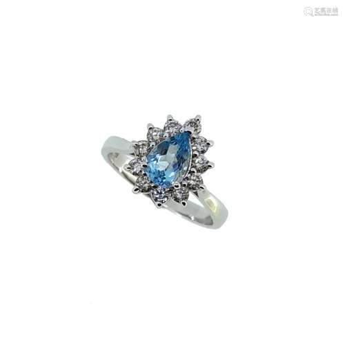 A pear shaped aquamarine and diamond cluster ring,