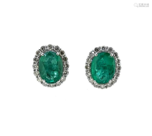 A pair of emerald and diamond ear studs,
