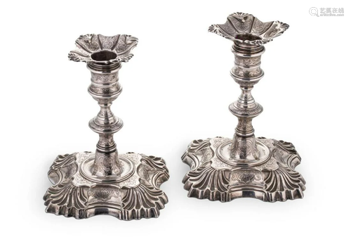 A pair of George II cast silver library candlesticks,