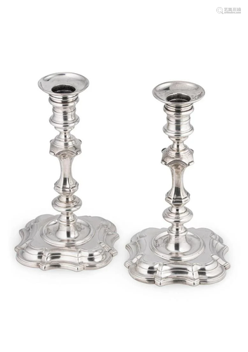 A pair of George II cast silver candlesticks, mark of George...