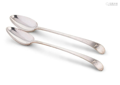 A pair of George III 18th century silver basting spoons,