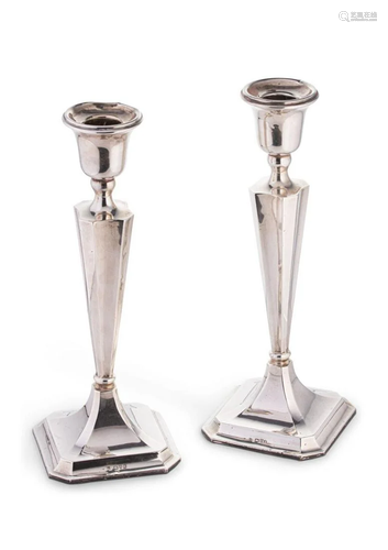 Chester - A pair of George V silver candlesticks,