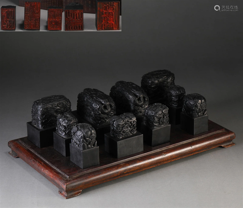 A Set of Ten Chinese Carved Rosewood Dragon Seals