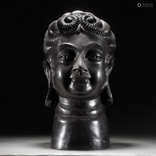 A Chinese Bronze Humanoid Head