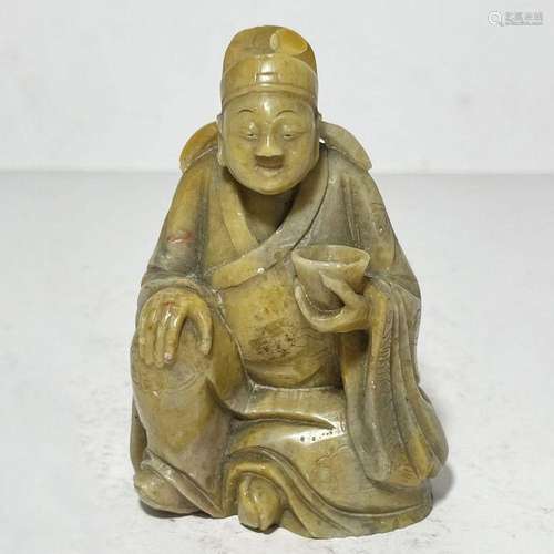 A CHINESE SOAPSTONE FIGURE