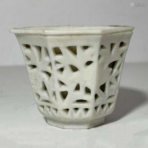 A CHINESE RETICULATED BLANC DE CHINE CUP, KANGXI PERIOD (166...