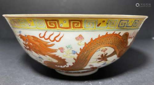 A CHINESE WUCAI 'DRAGON AND PHOENIX' BOWL WITH SEA...