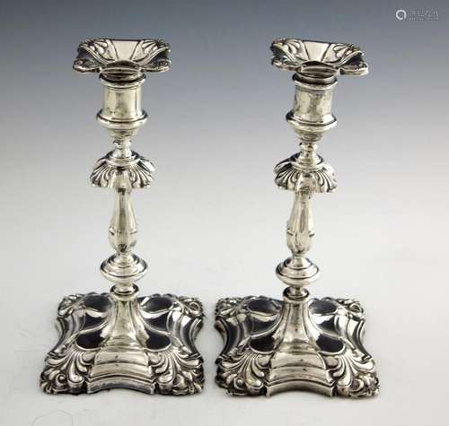 A pair of Edwardian silver candlesticks,