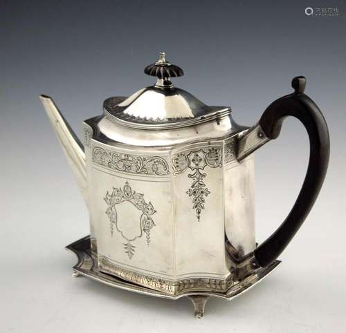 A George III silver teapot and stand, Ti