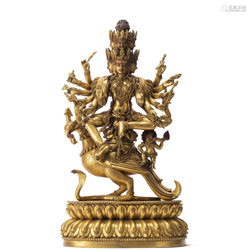 A FINE AND RARE TIBETAN BRONZE-GILT PROTECTOR