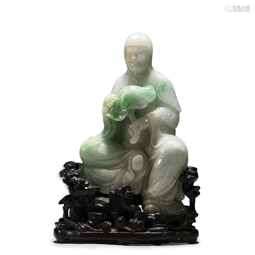 A CHINESE CARVED JADEITE BODHISATTVA