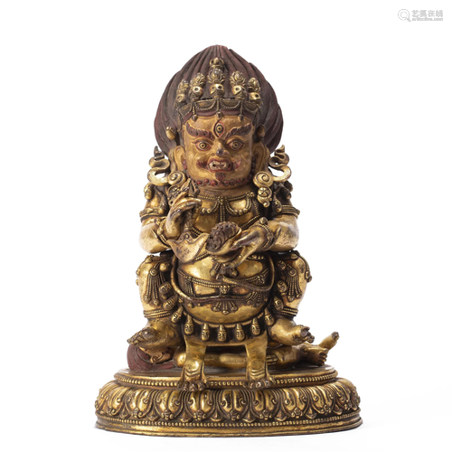 A TIBETAN BRONZE-GILT MAHAKALA