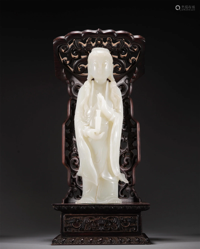 A CHINESE CARVED WHITE JADE FIGURE OF GUANYIN