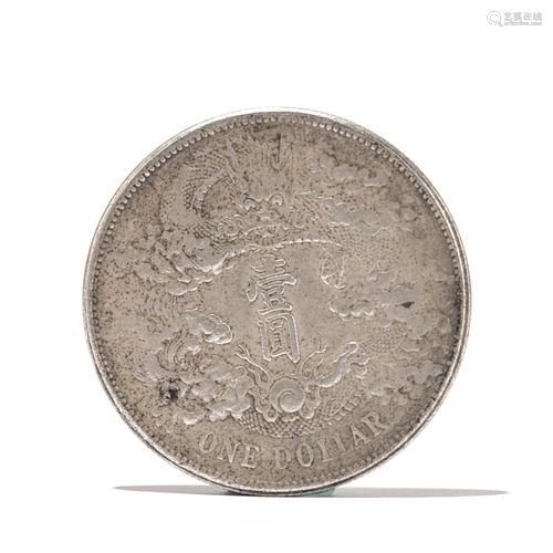 A CHINESE SILVER COIN