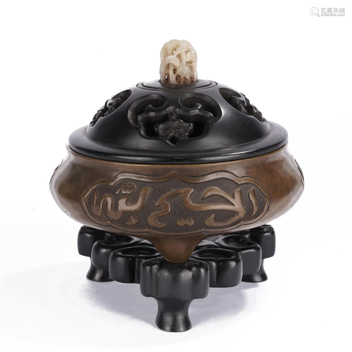 A CHINESE BRONZE TRIPOD CENSER