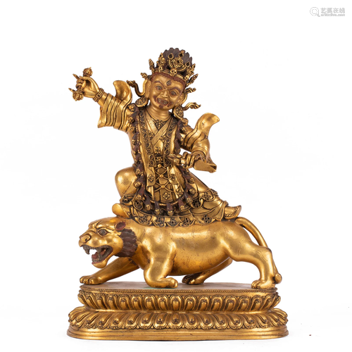 A TIBETAN BRONZE-GILT VAJRAPANI