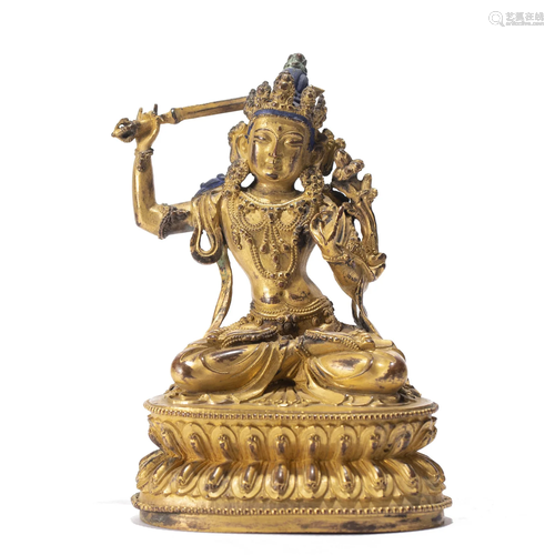 A TIBETAN BRONZE-GILT MANJUSRI