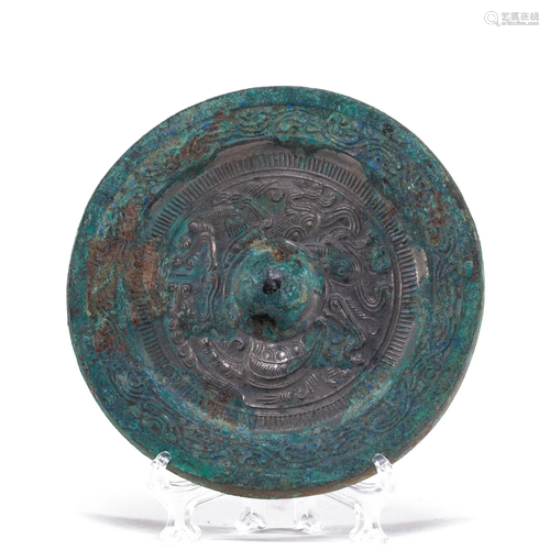 A BRONZE CIRCULAR MIRROR