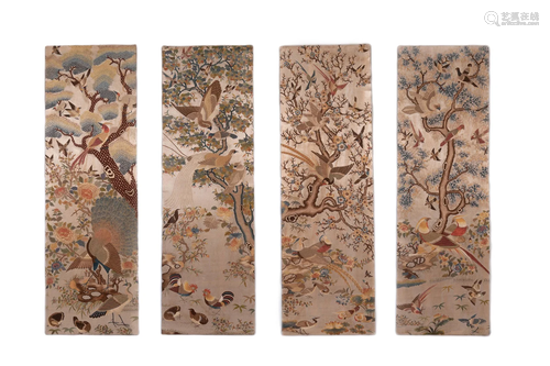 A SET OF FOUR EMBROIDERED HANGING PANELS