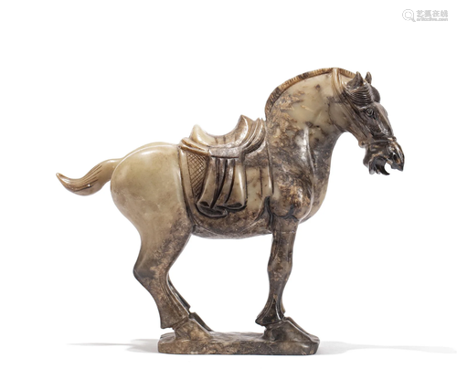 A CARVED JADE STANDING HORSE