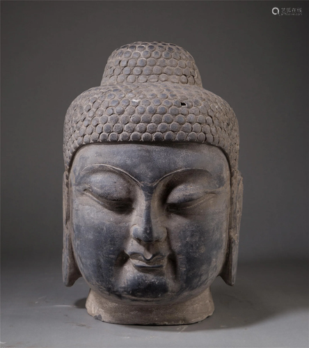 A CHINESE CARVED STONE BUDDHA HEAD