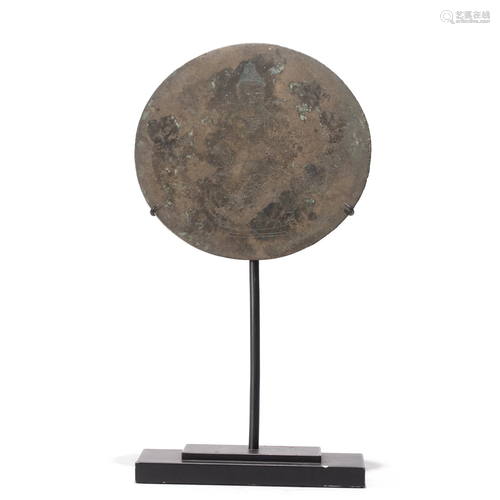 A CHINESE INCISED BRONZE MIRROR