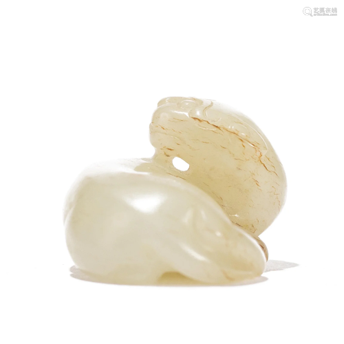 A CHINESE CARVED WHITE JADE BEAST