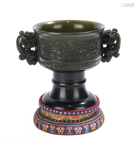 A CHINESE CARVED JADE STEAM CUP