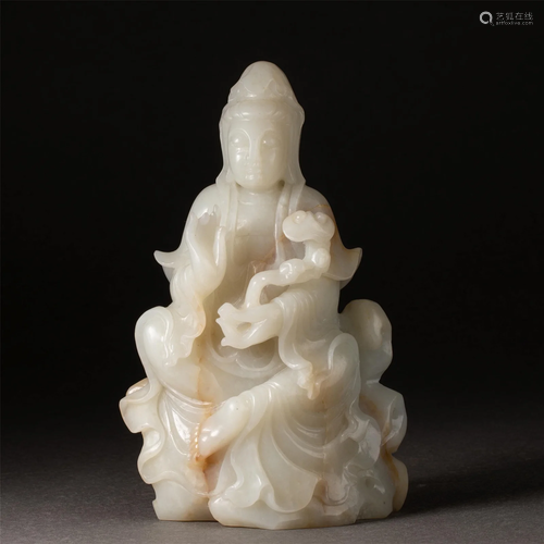 A CHINESE CARVED WHITE JADE FIGURE OF GUANYIN