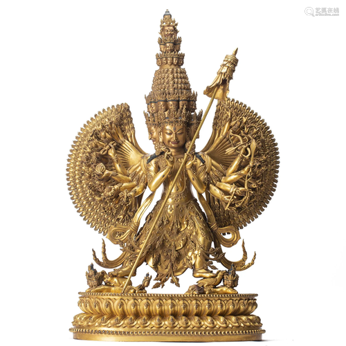 A MAGNIFICENT TIBETAN BRONZE-GILT MULTI-HANDS WRATHFUL DEITY