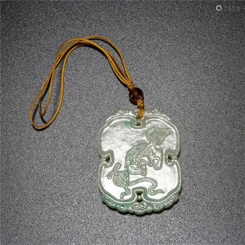 A CHINESE CARVED JADEITE PLAQUE