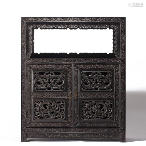 A CHINESE CARVED ROSEWOOD CABINET