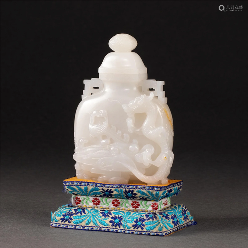 A CHINESE CARVED WHITE JADE VASE