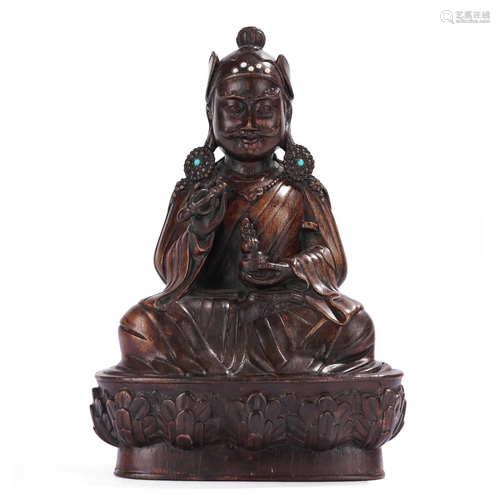 A CARVED ALOESWOOD FIGURE OF Padmasambhava