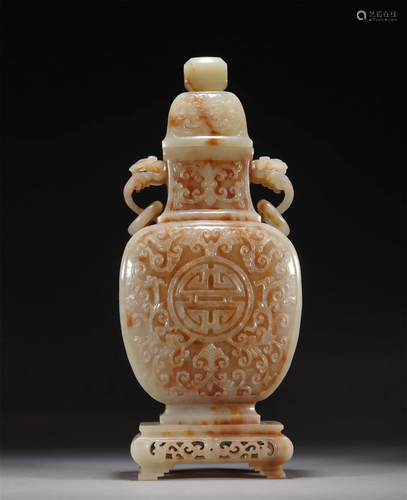 A CHINESE CARVED JADE VASE