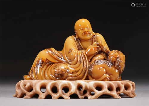 A CHINESE CARVED SOAPSTONE FIGURE OF ARHAT