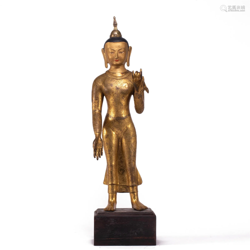 A BRONZE-GILT BUDDHA