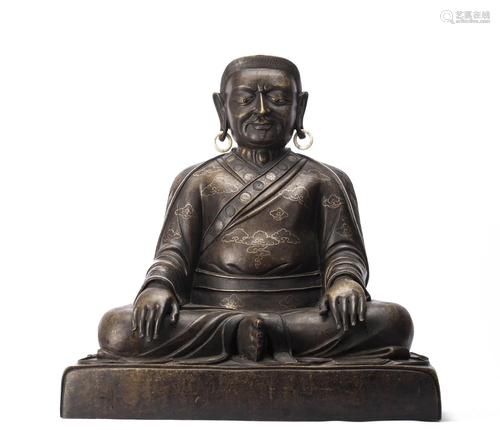 A SILVER INLAID BRONZE MASTER GURU