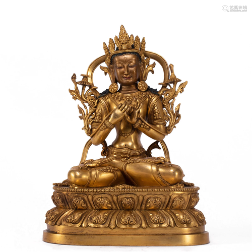 A TIBETAN BRONZE-GILT FIGURE OF MAITREYA