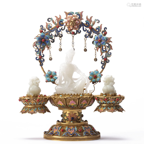 A CARVED WHITE JADE GUANYIN WITH ENAMELED STAND