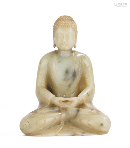 A CHINESE CARVED JADE SEATED SHAKYAMUNI