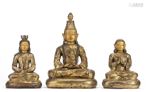 A BRONZE-GILT SONGTSEN GAMPO WITH ACOLYTES